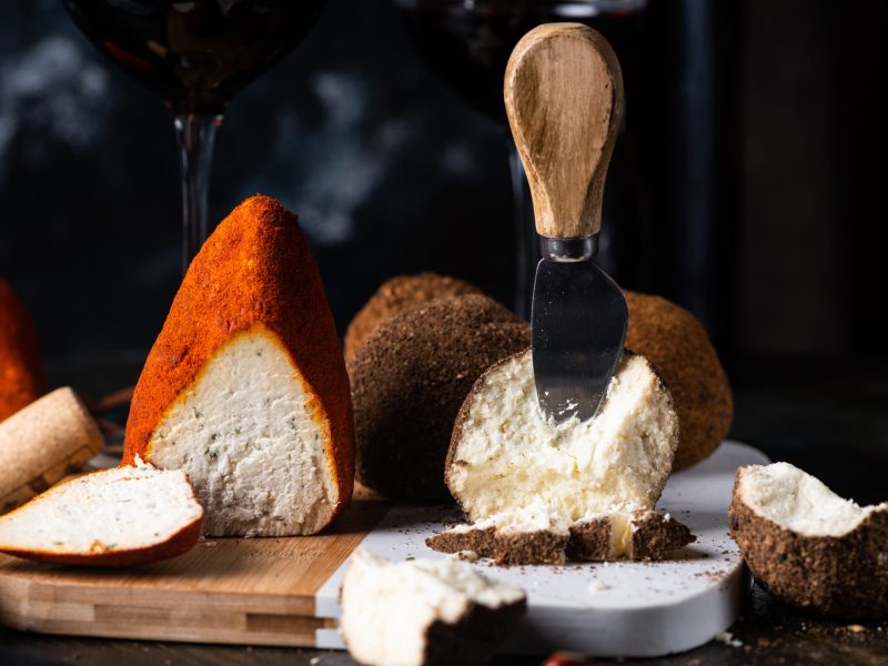 Swiss cheese belper knolle. Assortment of cheese. Cheese knife. Organic product. Black Pepper. italian appetizer