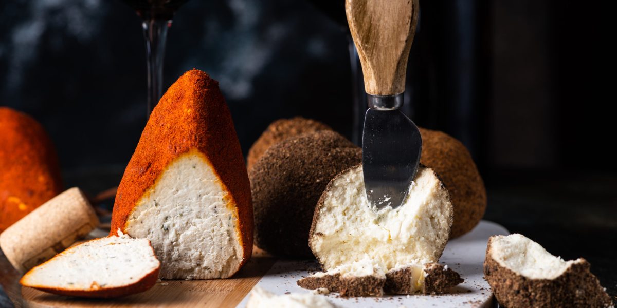 Swiss cheese belper knolle. Assortment of cheese. Cheese knife. Organic product. Black Pepper. italian appetizer
